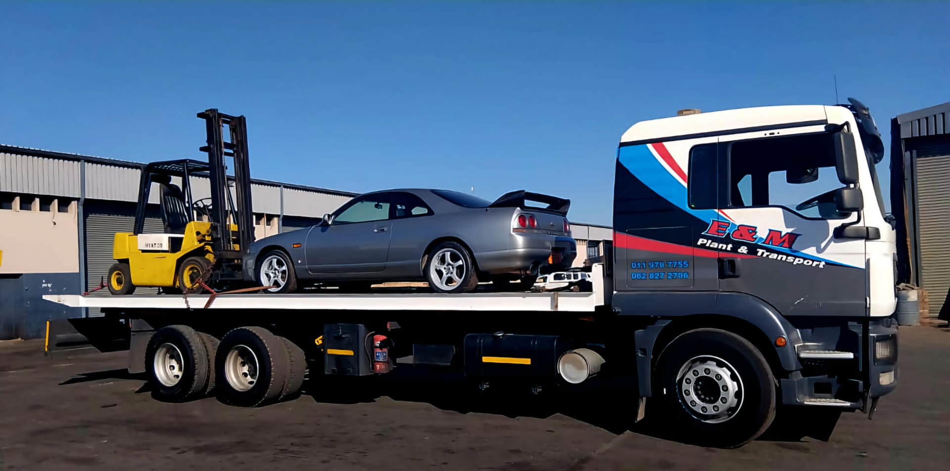 Rollback transporting a sports car